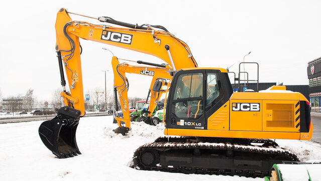 Riga, Latvia - February 7, 2026: New JCB excavators on the street near the auto center in winter