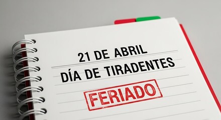 Fototapeta premium Dia de Tiradentes 21 de Abril holiday calendar, spiral notebook with Feriado red stamp, Brazilian national holiday reminder on white paper