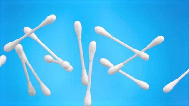 A clean, high-quality shot of white cotton swabs floating against a bright blue background. This minimalist visual is suitable for hygiene, skincare, personal care, medical, and wellness-themed commer
