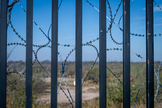 border fence with barbed wire