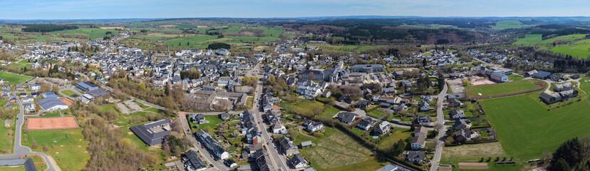 Obraz premium An Aerial view around the old town beside the city Saint Vith in the Belgium on a cloudy spring day