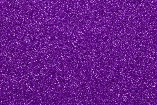 Textured backdrop with purple glitter