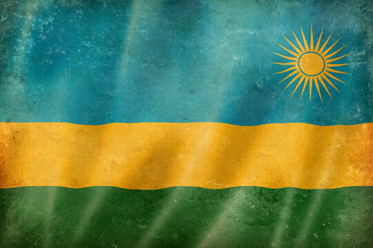 Old vintage flag of Rwanda, worn and stained