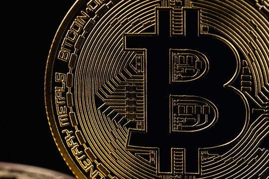 bitcoin cryptocurrency closeup on a black background. P2P trading, peer-to-peer payment system.