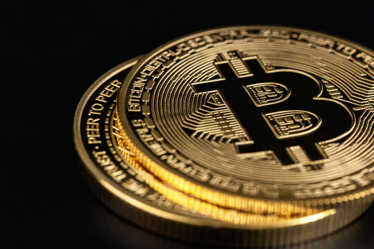 bitcoin cryptocurrency logo, symbol closeup on a black background.