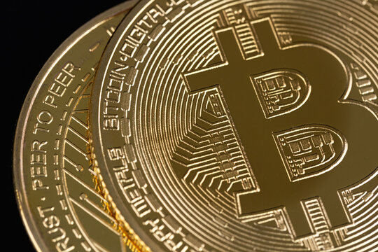 bitcoin cryptocurrency on a black background closeup. P2P trading, peer-to-peer payment system.