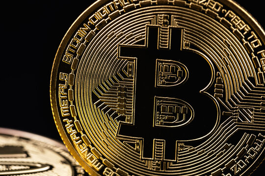 bitcoin cryptocurrency closeup, metal coin cryptocurrency on a black background.