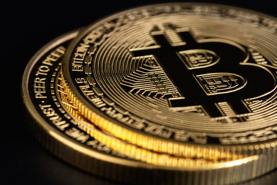 bitcoin cryptocurrency metal coin closeup on a black background. P2P trading,