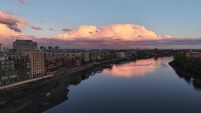 London, UK - April 20 2026: 4K aerial drone footage of Hammersmith Bridge and the Thames at sunset