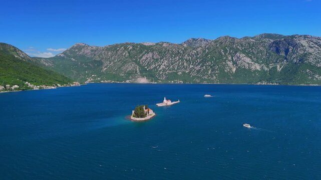 Aerial view of islands in the Bay of Kotor, featuring Our Lady of the Rocks Church and the Saint George Benedictine Monastery, Montenegro.