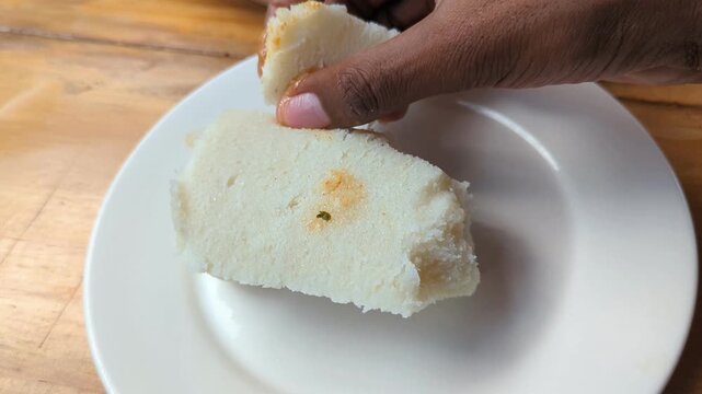 Ugali with Fish Stew in Slow Motion Video, Kenyan Cornmeal Staple Served with Spiced Fish Curry Traditional Food Scene
