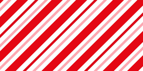 Fototapeta premium Candy cane Christmas background, peppermint diagonal stripes print seamless pattern