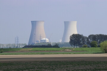 Fototapeta premium two cooling towers of nuclear plant 'Doel' in Belgium near the westerschelde