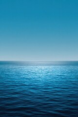 Obraz premium Infinite ocean meets clear blue sky