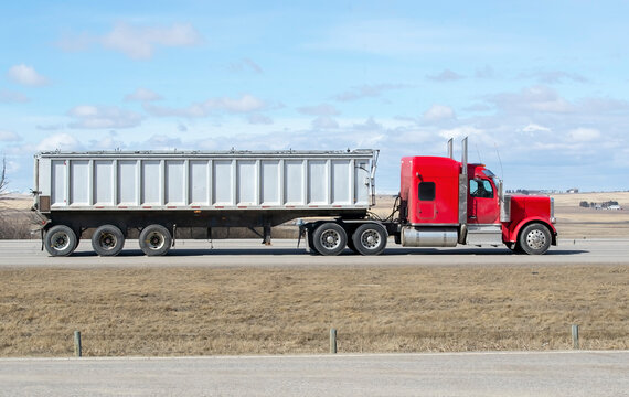 Heavy Cargo on the Road. A truck transporting cargo along a highway. Taken in Alberta, Canada
