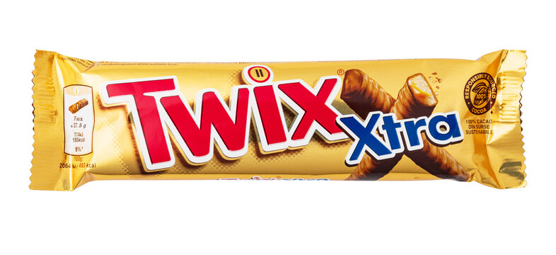 Twix xtra candy bar in gold wrapper on transparent background