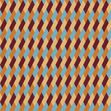 Seamless pattern designed from diagonal dark maroon, pale blue, cream and gold parallelograms
