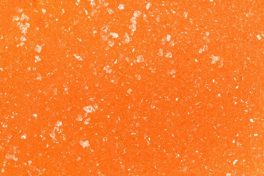 Texture of orange marmalade with sugar closeup