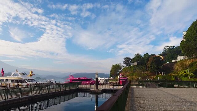 Sun Moon Lake Pier with Boats and Mountain Reflection at Sunrise in Taiwan