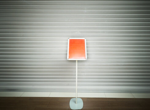 Empty red banner on the the metal pole background