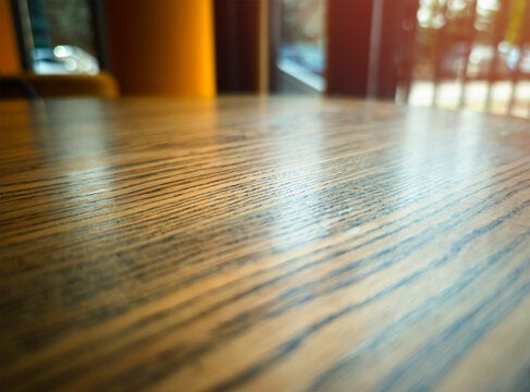 Wooden table in low angle perspective bokeh background