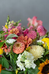 Fototapeta premium Vibrant mixed bouquet with zinnias, chrysanthemums, and sunflowers