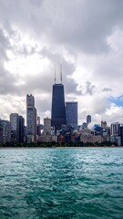 Obraz premium Chicago Lakefront Skyline with Highrise Tower and Dramatic Clouds.