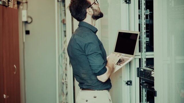 System Administrator Monitoring Network Hardware Infrastructure.   Information Technology Support and Maintenance Service