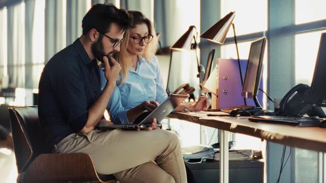 Professional Team Analyzing Data. Coworkers Sharing Ideas. Business Partners Working Together In Modern Office