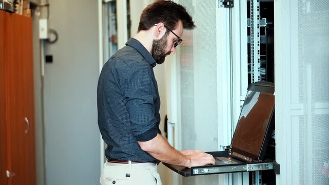 Work With Server Rack In Data Center. IT Specialist Configuring Network Hardware 