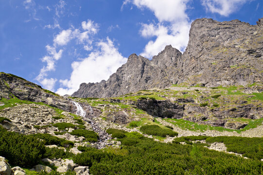 Velicky waterfall flowing down a rocky mountain wall under Gerlachovsky stit, High Tatras, Slovakia.