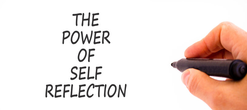 Self reflection symbol. Concept words The power of self reflection on beautiful white paper. Beautiful white background. Businessman hand. Business the power of self reflection concept. Copy space.