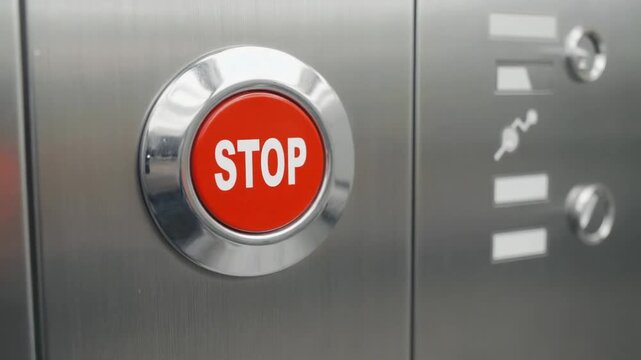Stop button in the elevator.