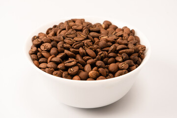 Fototapeta premium Coffee beans on a white background. Top view. Coffee beans texture.