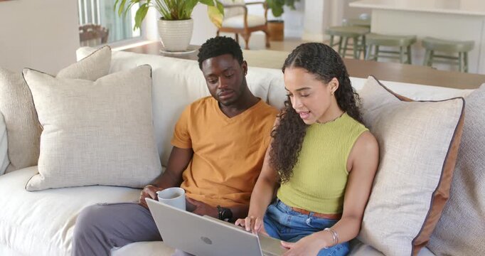 Vertical video: Woman starting typing on laptop, couple working on tech task while man holding mug