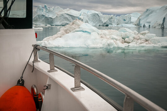 Ilulissat, Disko Bay, Greenland - Minimal Arctic Adventure Scene of an Expedition Boat Transom with Red Fender Among Icebergs of Ilulissat Icefjord Greenland
