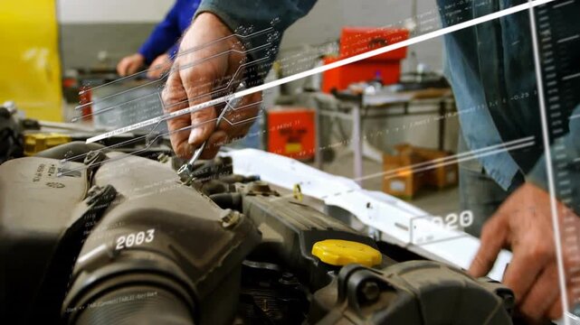 Tech turning tool on auto engine, loosening clamp for service while timeline moving over hands