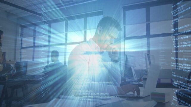 Typing man causing blue data overlay pulsing while studying documents and visualizing code