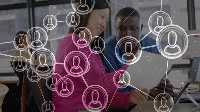 Pair leaning over paper, bubbles starting network overlay drifting over faces mapping business ties