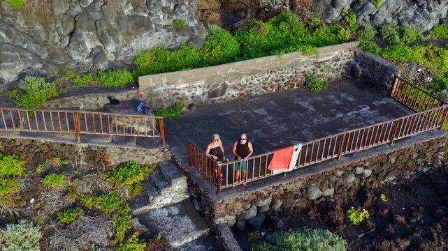 Couple Hiking the Ruta de los Volcanes Toward Caldera de Taburiente; La Palma Canary Islands Adventure Travel and Trekking; Man and Woman Backpacking on Volcanic Ridge Trail