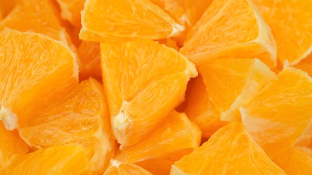 Heap chopped orange fruit, rotation. Natural healthy snack ideas