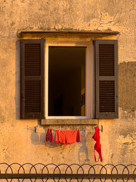 Underwear drying on a clothesline outside building window