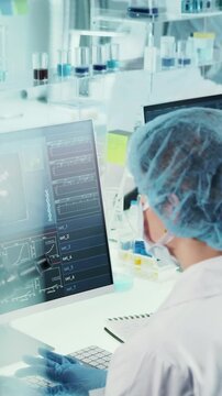 Research team with a female leader working in a neurological laboratory studying biological samples and human DNA to prevent neurodegenerative disorders