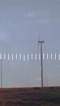 Vertical video: Overlay appearing, pulsing over field, turbine blades turning, values showing power