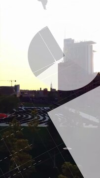 Vertical video: Pair of towers framing while camera panning causing tech HUD graphs showing metrics