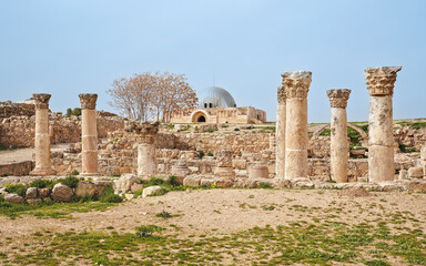 Naklejka premium Stone columns remains in front of Umayyad Palace Mosque at Amman citadel in Jordan capital