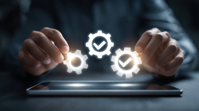 Hands holding gears over a tablet screen