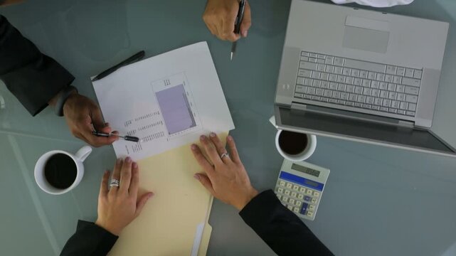 Timelapse overhead shot of business people meeting in office