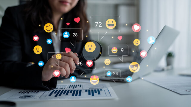 A business professional analyzes social media metrics while interacting with vibrant digital reactions. The image captures modern workplace dynamics and engagement trends. Ledger