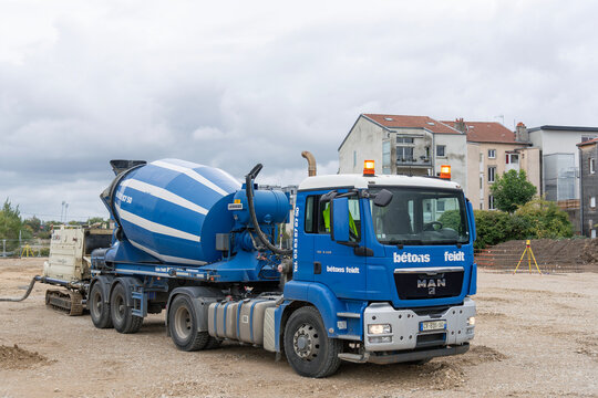 Nancy, France - October 9th 2019 : View on a blue concrete mixer truck MAN TGS 18.440 delivering concrete to a construction site for special foundations.